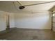 Spacious garage with overhead door and Quantum garage door opener at 43241 W Kristal Ln, Maricopa, AZ 85138