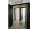 Hallway with vinyl floors, doors, and a view of other rooms at 43241 W Kristal Ln, Maricopa, AZ 85138