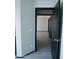 An open door from the hallway leads to a bedroom at 43241 W Kristal Ln, Maricopa, AZ 85138