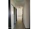 Hallway with vinyl floors, doors, and a view of other rooms at 43241 W Kristal Ln, Maricopa, AZ 85138