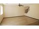 Open living room with wood flooring, a ceiling fan, and staircase at 43241 W Kristal Ln, Maricopa, AZ 85138