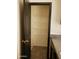 View of a pantry with multiple shelves, a dark door, and a golden handle at 43241 W Kristal Ln, Maricopa, AZ 85138