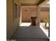 Covered patio area with concrete flooring, and access to the backyard at 43241 W Kristal Ln, Maricopa, AZ 85138