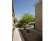 Landscaped side yard featuring mature desert landscaping and pedestrian sidewalk, for a natural desert feel at 43241 W Kristal Ln, Maricopa, AZ 85138