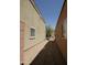 View of the narrow side yard featuring desert landscaping between two homes at 43241 W Kristal Ln, Maricopa, AZ 85138