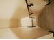 Bright staircase featuring a dark handrail and light wood-look floors at 43241 W Kristal Ln, Maricopa, AZ 85138