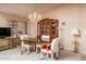 Inviting dining area with a decorative chandelier, stylish furniture, and a display cabinet at 441 E Pinto Dr, Gilbert, AZ 85296