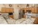Efficient kitchen with stainless steel appliances, granite countertops, and functional layout at 441 E Pinto Dr, Gilbert, AZ 85296