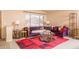 Comfortable living room showcases a plush sofa, decorative rug, and ample natural light at 441 E Pinto Dr, Gilbert, AZ 85296