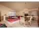 Open-concept living and dining area with stylish furnishings, abundant natural light, and cohesive decor at 441 E Pinto Dr, Gilbert, AZ 85296