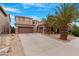 Charming home featuring desert landscaping, a spacious driveway, and a three-car garage at 44348 W Windrose Dr, Maricopa, AZ 85138