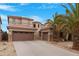 Expansive home with a three-car garage and desert landscaping for low-maintenance appeal at 44348 W Windrose Dr, Maricopa, AZ 85138