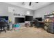 Spacious office area features multiple monitors and shelving, ideal for productivity and organization at 44348 W Windrose Dr, Maricopa, AZ 85138