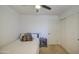 Bedroom with carpet flooring, ceiling fan, sliding closet doors, and neutral paint at 4609 E Ironhorse Rd, Gilbert, AZ 85297