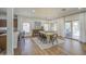 Open dining room area with modern chandelier, stylish chairs, and adjacent breakfast bar seating at 4609 E Ironhorse Rd, Gilbert, AZ 85297