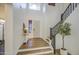 Bright entryway featuring hardwood floors, a high ceiling, and an elegant staircase at 4609 E Ironhorse Rd, Gilbert, AZ 85297