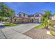 Beautiful two-story home featuring a spacious driveway and meticulously maintained landscaping at 4609 E Ironhorse Rd, Gilbert, AZ 85297