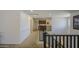 Bright upper level hallway featuring neutral carpet and a view of the lower level at 4609 E Ironhorse Rd, Gilbert, AZ 85297