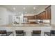 Spacious kitchen featuring custom cabinets, granite countertops, stainless steel appliances, and a breakfast bar at 4609 E Ironhorse Rd, Gilbert, AZ 85297