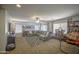 Carpeted bonus room offers sectional couch, ceiling fan, natural light, and built-in shelving with entertainment at 4609 E Ironhorse Rd, Gilbert, AZ 85297