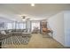 Carpeted bonus room offers a ceiling fan, natural light, sectional couch and entertainment features at 4609 E Ironhorse Rd, Gilbert, AZ 85297