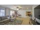 Spacious living room with neutral tones, a comfortable sofa, and a fun basketball game setup at 4609 E Ironhorse Rd, Gilbert, AZ 85297