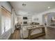 Bright living room with wood flooring, fireplace, and large windows for natural light at 4609 E Ironhorse Rd, Gilbert, AZ 85297