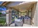 Comfortable covered patio furnished with cozy seating, perfect for relaxing and entertaining in style at 4609 E Ironhorse Rd, Gilbert, AZ 85297