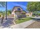 This two-story home boasts a lush lawn with desert landscaping and ample natural light at 4609 E Ironhorse Rd, Gilbert, AZ 85297