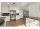 Bright kitchen with white cabinets, stainless steel appliances, butcher block counters, and modern backsplash at 4939 E Paradise Dr, Scottsdale, AZ 85254