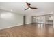 Spacious living room with hardwood floors, ceiling fan, and open layout to the backyard patio at 4939 E Paradise Dr, Scottsdale, AZ 85254