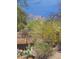 Enjoy the mountain views from a desert backyard surrounded by lush vegetation at 5141 E Rancho Tierra Dr, Cave Creek, AZ 85331