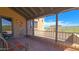 Covered balcony with desert views and Spanish-style tiling at 5141 E Rancho Tierra Dr, Cave Creek, AZ 85331