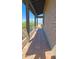 Tiled balcony with desert views, supported by wood beams and posts at 5141 E Rancho Tierra Dr, Cave Creek, AZ 85331