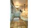 A unique bathroom offers tile flooring, a decorative mirror, and a built-in bathtub at 5141 E Rancho Tierra Dr, Cave Creek, AZ 85331