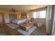 Bedroom featuring a ceiling fan, hardwood floors, and sliding closet doors at 5141 E Rancho Tierra Dr, Cave Creek, AZ 85331