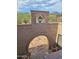 Inviting courtyard with brick archway, charming landscaping, and mountain views at 5141 E Rancho Tierra Dr, Cave Creek, AZ 85331