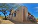 Desert home showcasing brick exterior and private balcony, with desert landscape at 5141 E Rancho Tierra Dr, Cave Creek, AZ 85331