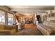 Inviting living room boasts rustic beams, terra cotta tile floors, and comfortable seating at 5141 E Rancho Tierra Dr, Cave Creek, AZ 85331