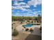 Elevated view of a backyard pool with desert landscaping and lounge seating at 5141 E Rancho Tierra Dr, Cave Creek, AZ 85331