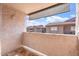 Outdoor balcony space with tiled flooring and views of the community at 623 W Guadalupe Rd # 288, Mesa, AZ 85210