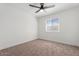Bright bedroom featuring plush carpeting, a modern ceiling fan and natural light from a window at 623 W Guadalupe Rd # 288, Mesa, AZ 85210