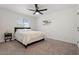 Cozy bedroom with plush carpet, a ceiling fan, and natural light at 623 W Guadalupe Rd # 288, Mesa, AZ 85210