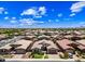 Bird's eye view of a suburban neighborhood showcasing residences with tile roofs and well-kept yards at 683 W Honey Locust Ave, Queen Creek, AZ 85140