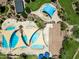 Overhead shot of a modern community pool area featuring geometric pool designs and shaded lounging spots at 683 W Honey Locust Ave, Queen Creek, AZ 85140