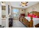 Bedroom with a beautifully carved wooden bed frame and an ensuite bath at 683 W Honey Locust Ave, Queen Creek, AZ 85140