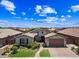 Well-maintained single-Gathering home featuring a manicured lawn, desert landscaping, and a welcoming front porch at 683 W Honey Locust Ave, Queen Creek, AZ 85140