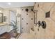 Walk-in shower features decorative tile, sleek fixtures, and a rain shower head at 683 W Honey Locust Ave, Queen Creek, AZ 85140