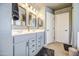 Bright bathroom with a double vanity and neutral wall color, cabinets, and flooring at 935 S Deerfield Ln, Gilbert, AZ 85296