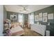 Cozy bedroom with pink accents, decorated with stuffed animals and custom artwork at 935 S Deerfield Ln, Gilbert, AZ 85296